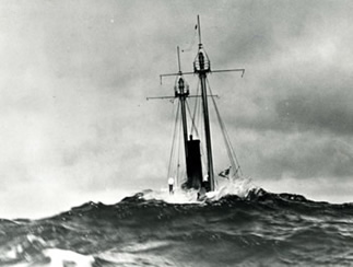LV-112, on Nantucket Shoals station during a storm at sea with a wave breaking over the stern section. Photo was taken from another vessel, prior to 1960. (photo courtesy of Don Yeskoo)